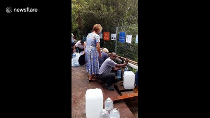 Cape Town families continue to collect water during the drought
