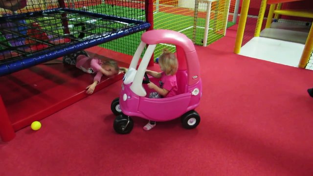 Happy Baby driver girl in the funny Little Tikes Cozy Coupe Cab Car jacking