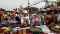 Housewives sway their bodies while making famous Thai dish