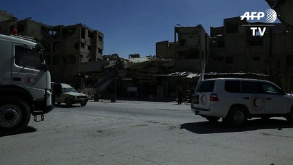 Aid convoy enters Syria's battered Ghouta