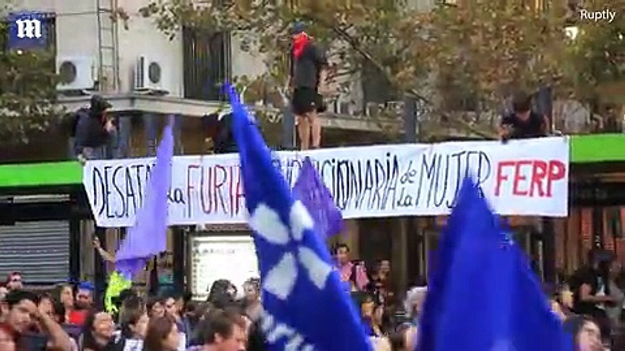 Chilean women strip naked to protest violence a...