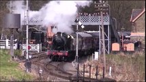 Outgoing Steam Engine departs Railway Train Station and crosses Bridge with 8 Carriages