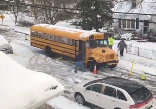 School Bus Driver Removes Dangling Power Line, Traffic Cones and Caution Tape From His Way