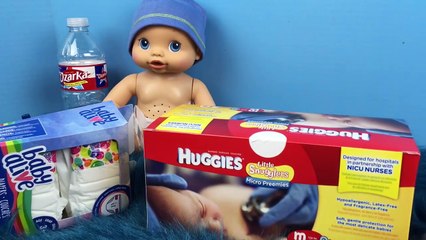 Baby Alive Wets n Wiggles Sherlock Pees on me and New Winnie the Pooh Micro Preemie Huggies Diapers