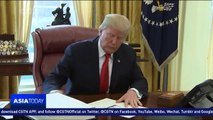 US President Trump signs tax overhaul legislation into law