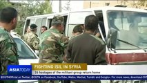Syrian hostages who fled ISIL return home