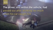Passed out drunk driver rescued from burning vehicle