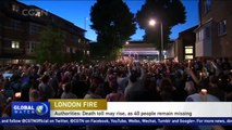 British PM May rushed from area of London fire after protests