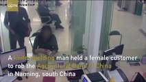 Bank employee saves hostage, takes down knife-wielding robber in S. China