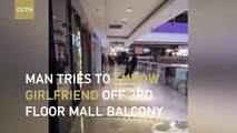 Man tries to throw girlfriend off 3rd floor mall balcony