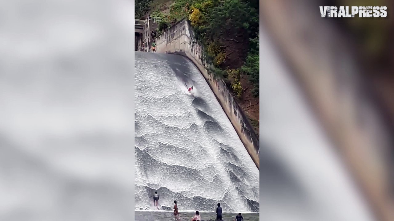 FUN! Children Use Dam As Water Slide