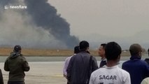 Smoke billows from passenger plane following Kathmandu crash