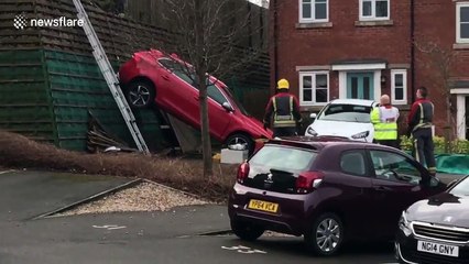 Driverless car rolls drops 4 feet and lands in neighbour's front yard