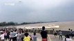 Footage:  Tidal bore of Qiantang River washes away dozens of spectators