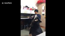 Alaskan Malamute sings along with piano-playing owner