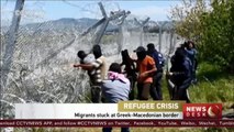 Migrants try to tear down wire fence at Greek-Macedonian border