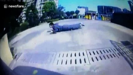 Car's near miss with skateboarder caught on dashcam