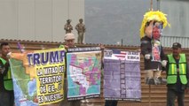 Protesters greet President Trump as he visits border wall prototypes