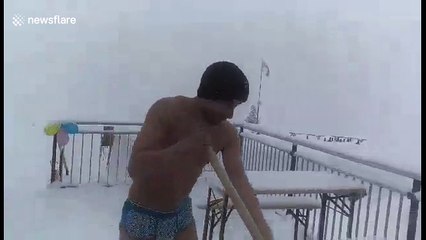 Naked man shovels snow in -10C at Italian resort