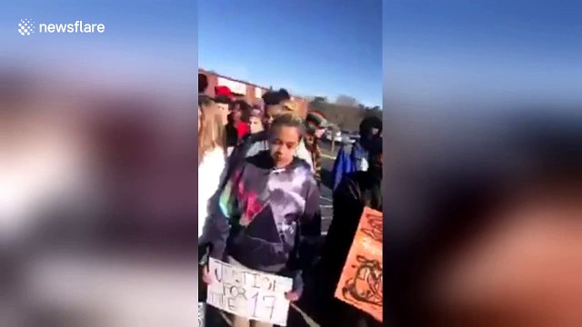 US students walkout to demand tighter gun control one month after Florida shooting