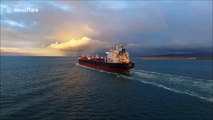 Drone films tanker ship sailing into dramatic Northern Ireland sunset