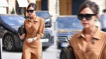 Victoria Beckham shows off her trim figure in chic wraparound shirt dress as she arrives at the Ritz in Paris.