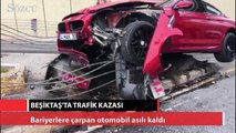 Beşiktaş’ta bariyerlere çarpan otomobil asılı kaldı