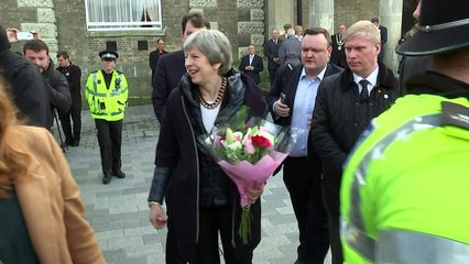 May shares fist bump with member of Salisbury public