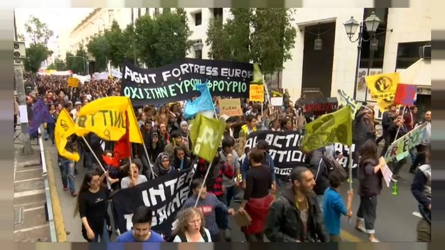 Migrants stranded in Greece march against racism