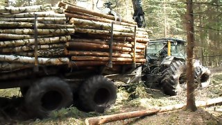 Valtra forestry tror with big, fully loaded trailer