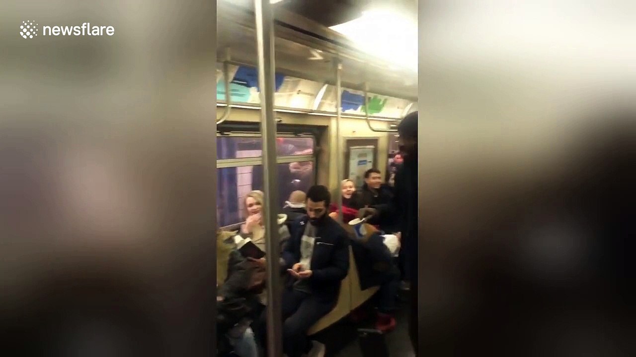 Busker brightens New Yorkers' day with rousing rendition of 'Lean on Me'