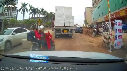 Driver lucky to survive after huge bricks fall from lorry, crushing vehicle