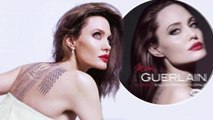 Angelina Jolie proudly flaunts tattoo which 'spiritually binds' her with estranged husband Brad Pitt in new perfume ad.