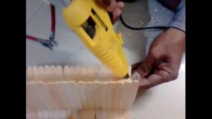 Two models of table holder stand - one using popsile sticks and other using news