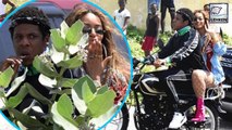 Beyonce Sits On The Back Of A Bike Ridden By An Awkward Jay-Z