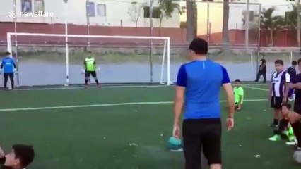 Best penalty EVER! Street footballer schools keeper with audacious backheel