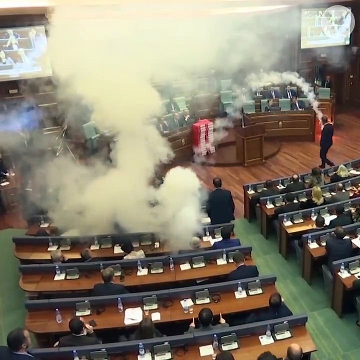 Opposition MPs in Kosovo release tear gas into Parliament to prevent a vote.
