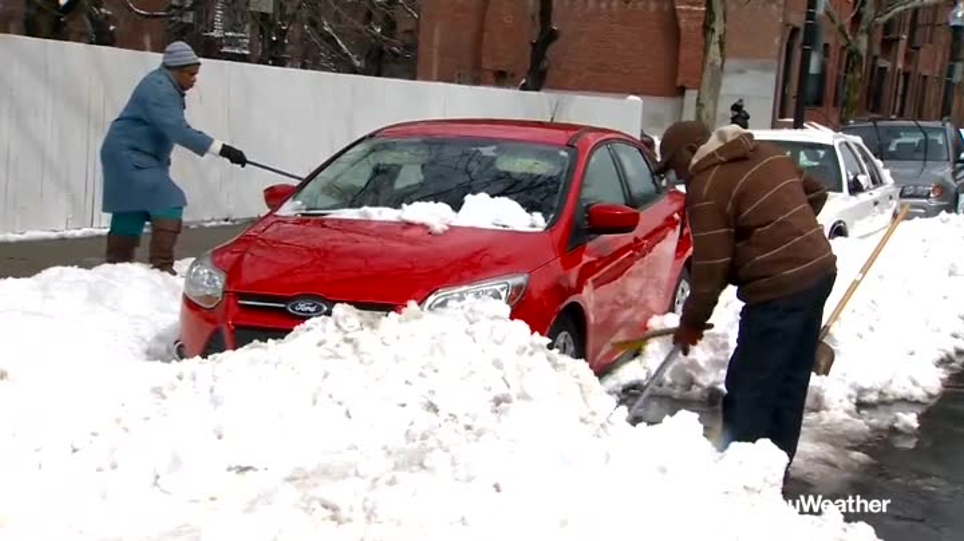 ⁣Boston residents dig out after nor'easter