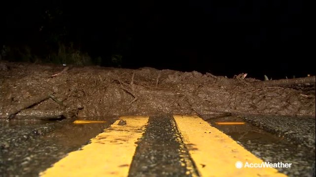 Heavy rain triggers mudslide, trapping drivers