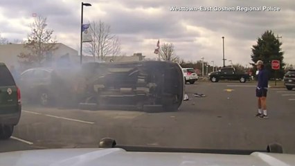 Watch as Good Samaritans Flip Burning SUV, Save Driver