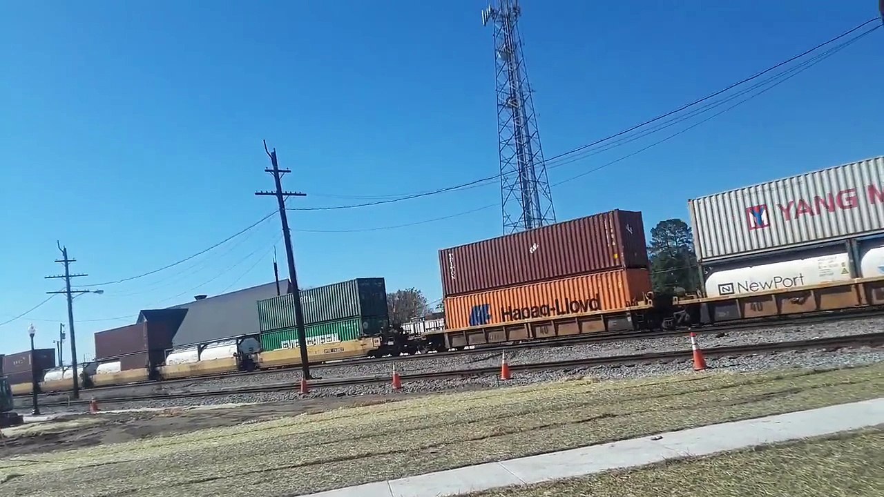 NS 23G dual stack container train (with a train engine in the middle) crosses liberty street