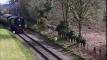 Steam Train Slowly Building up Speed after Leaving Railway Train Station