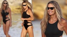 Ageless Elle Macpherson, 53, flaunts her toned figure in a sexy black swimsuit while on sunny vacation in Sydney.