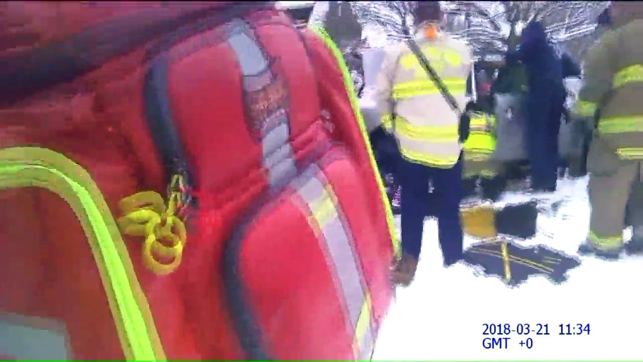Video Shows Firefighters Rescuing Woman Trapped Under Car