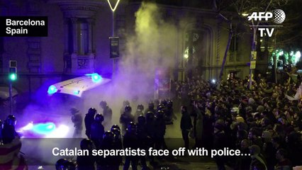 Police and protesters clash in Barcelona