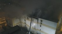 Suben a 64 las víctimas mortales por incendio en centro comercial de Siberia