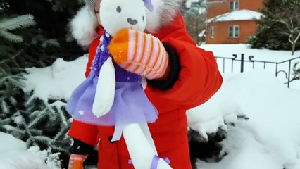 Alena plays with toy Hares on Outdoor playground for kids Family fun Play area