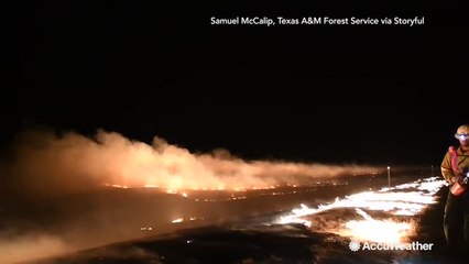 Night video shows Texas firefighters using 'burning out' technique to battle wildfire