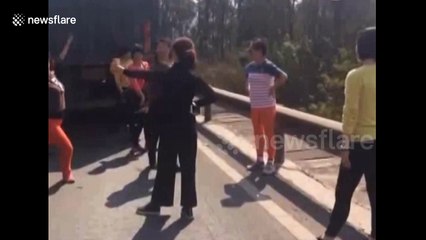 Tourists dance in the street after getting stuck in traffic