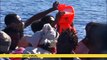 NGO rescues over 100 migrants at sea, watched by Libyan coastguard